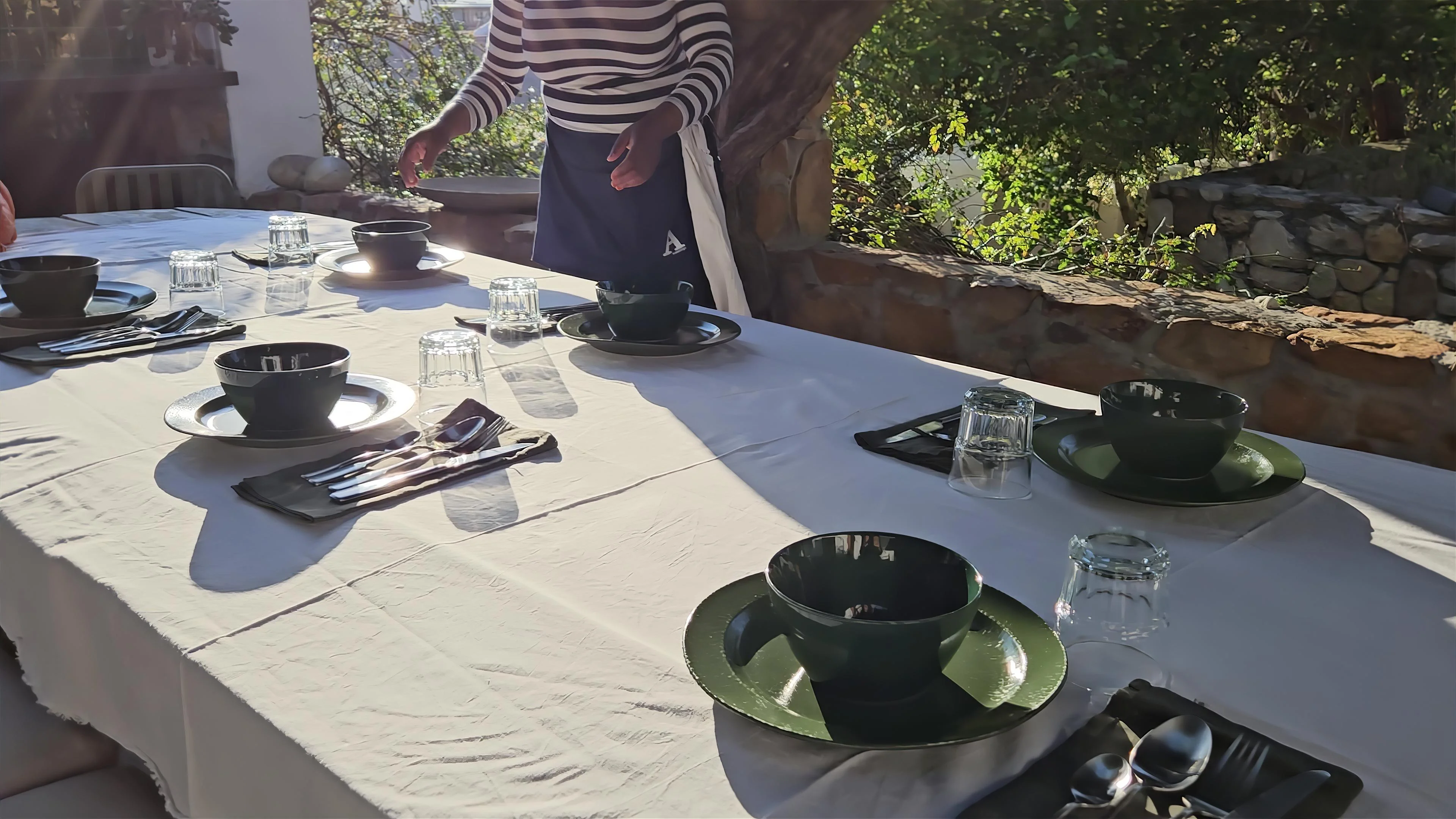 The garden at InAweStays, Camp Street, Gardens, Cape Town - a shaded table among old trees